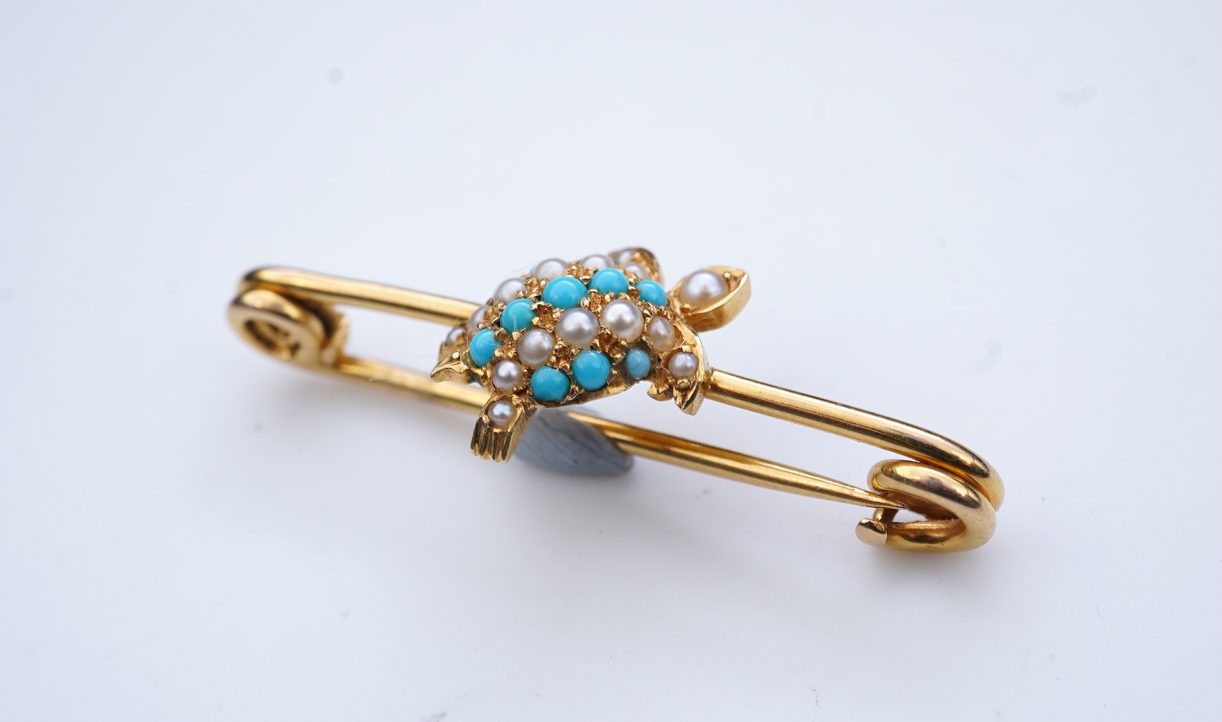 An Edwardian seed pearl and turquoise bar brooch, early 20th century